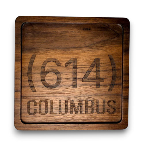 Wooden coaster made of black walnut featuring a personalized laser engraved design.