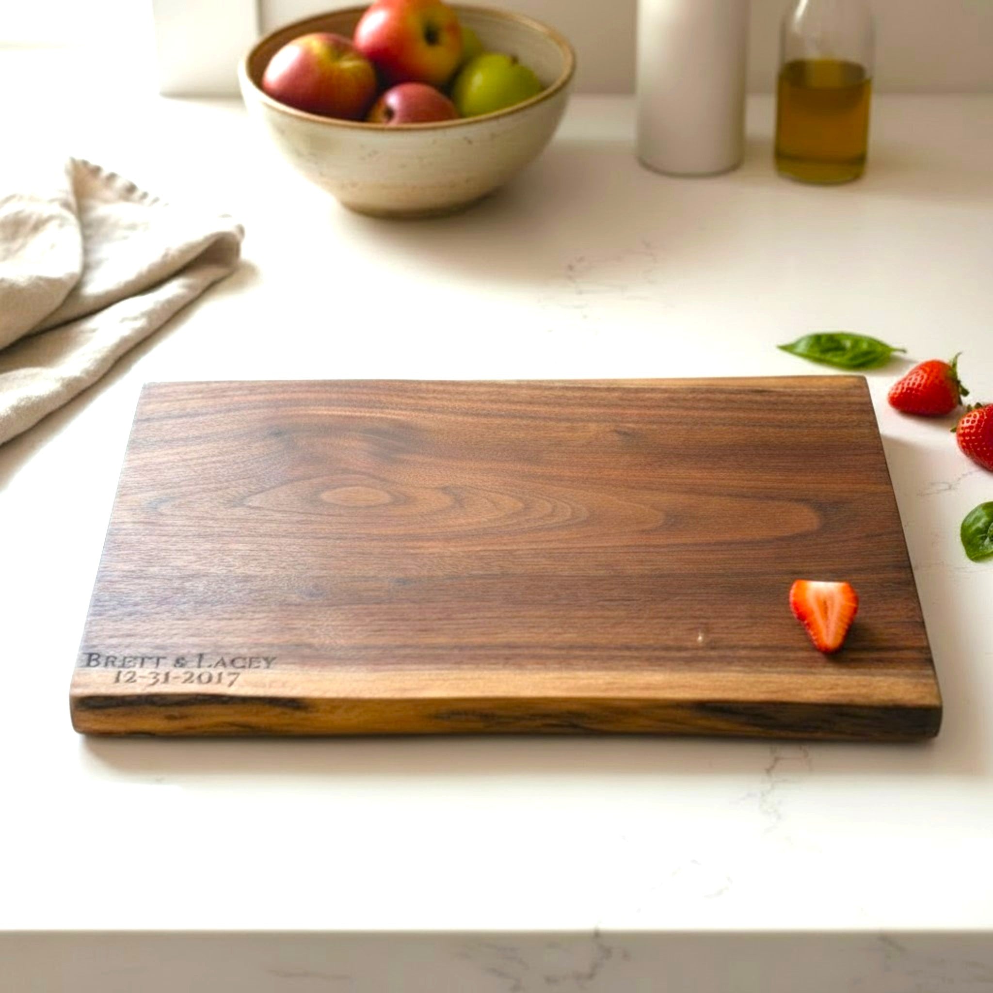 Live edge black walnut wooden cutting board with personalized laser engraved text