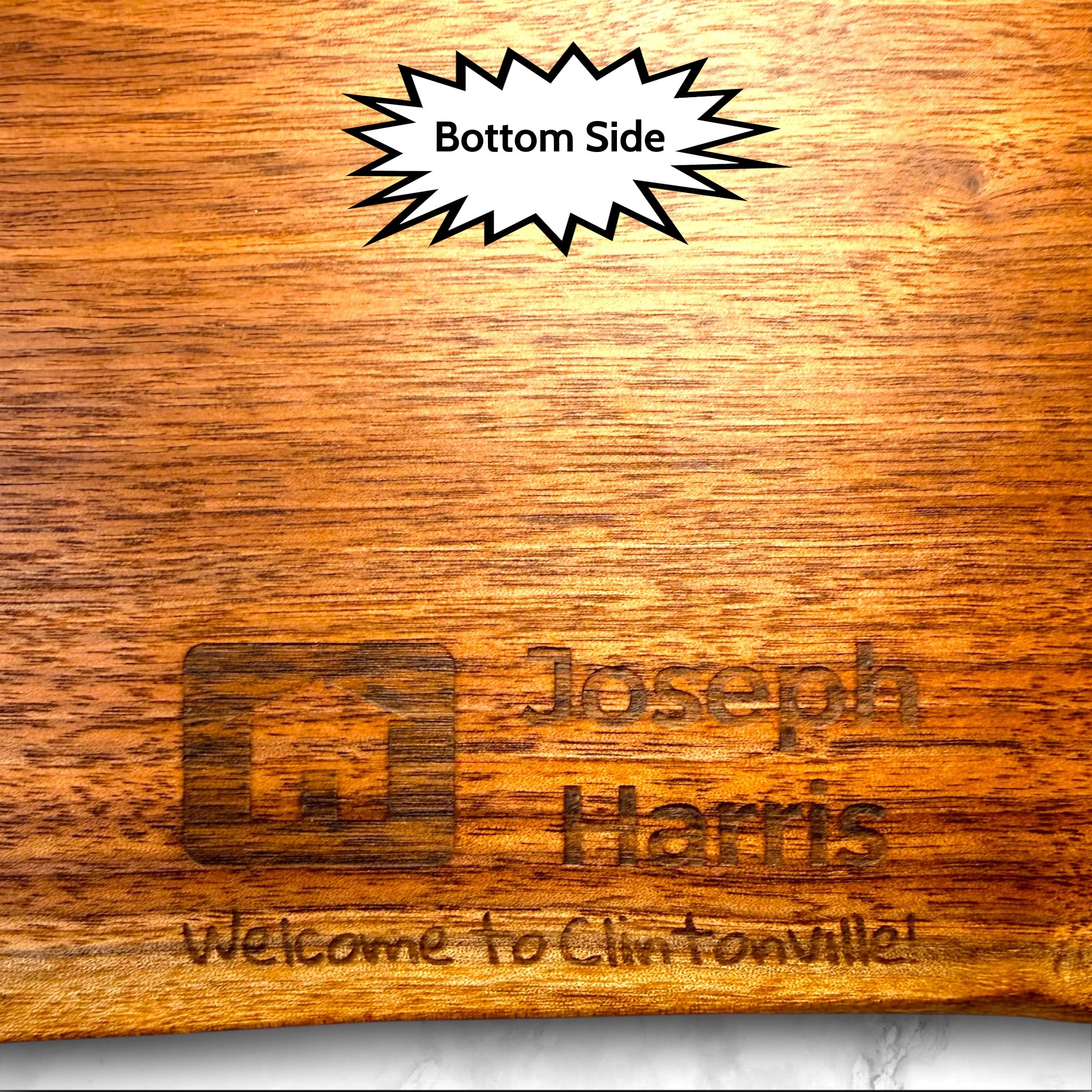 Live edge black walnut wooden cutting board with personalized laser engraved text