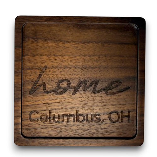 Wooden coaster made of black walnut featuring a personalized laser engraved design.