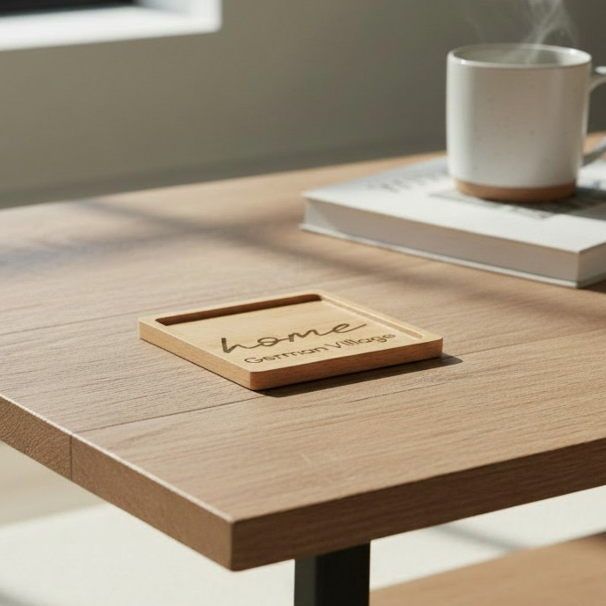 Wooden coaster made of beech featuring a personalized laser engraved design, sitting on a table.