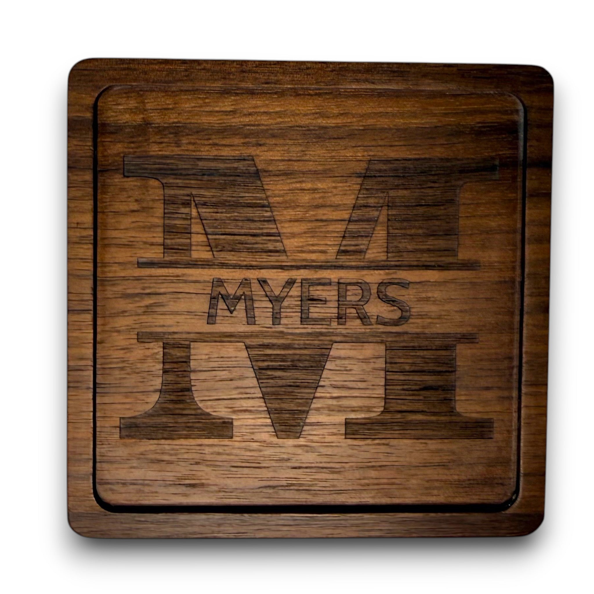 Wooden coaster made of black walnut featuring a personalized laser engraved design.