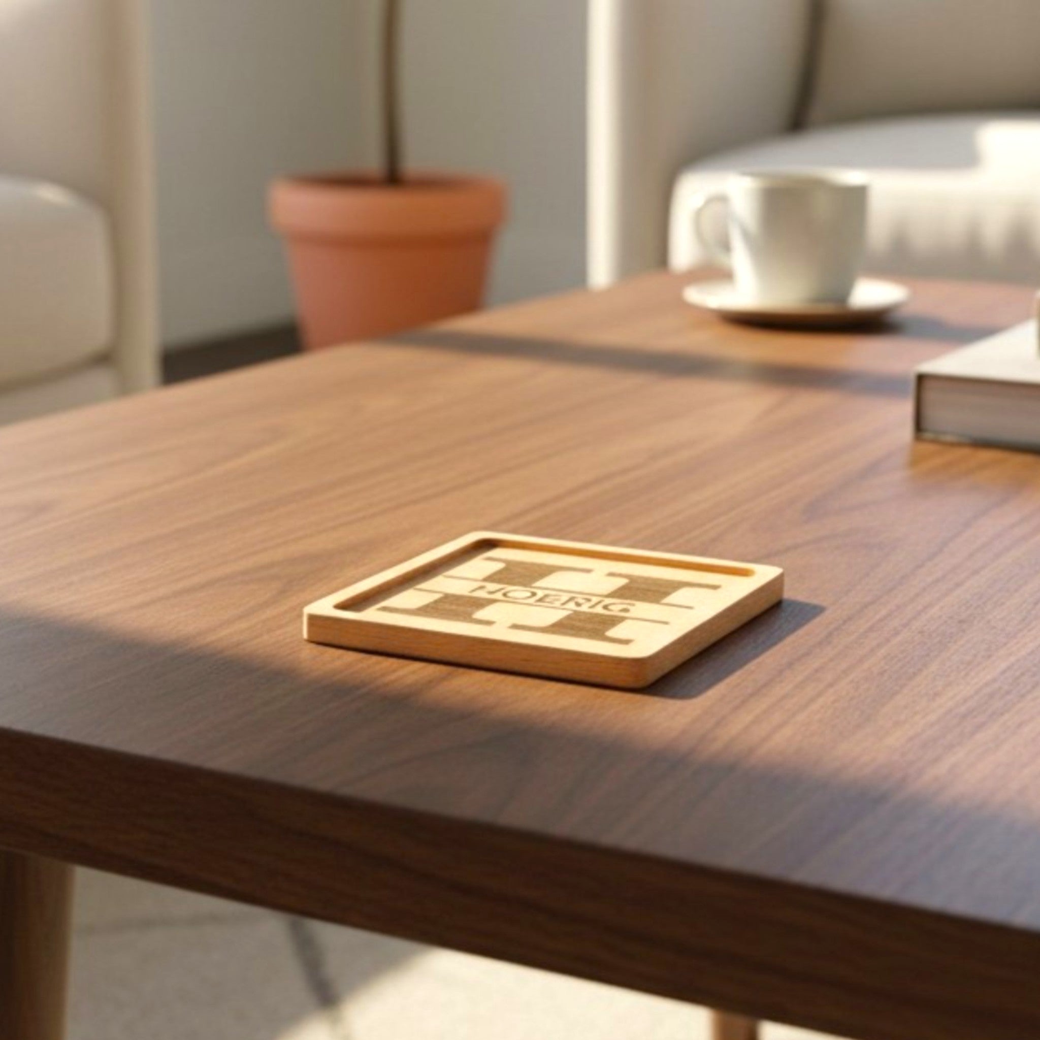 Wooden coaster made of beech featuring a personalized laser engraved design, sitting on a table.