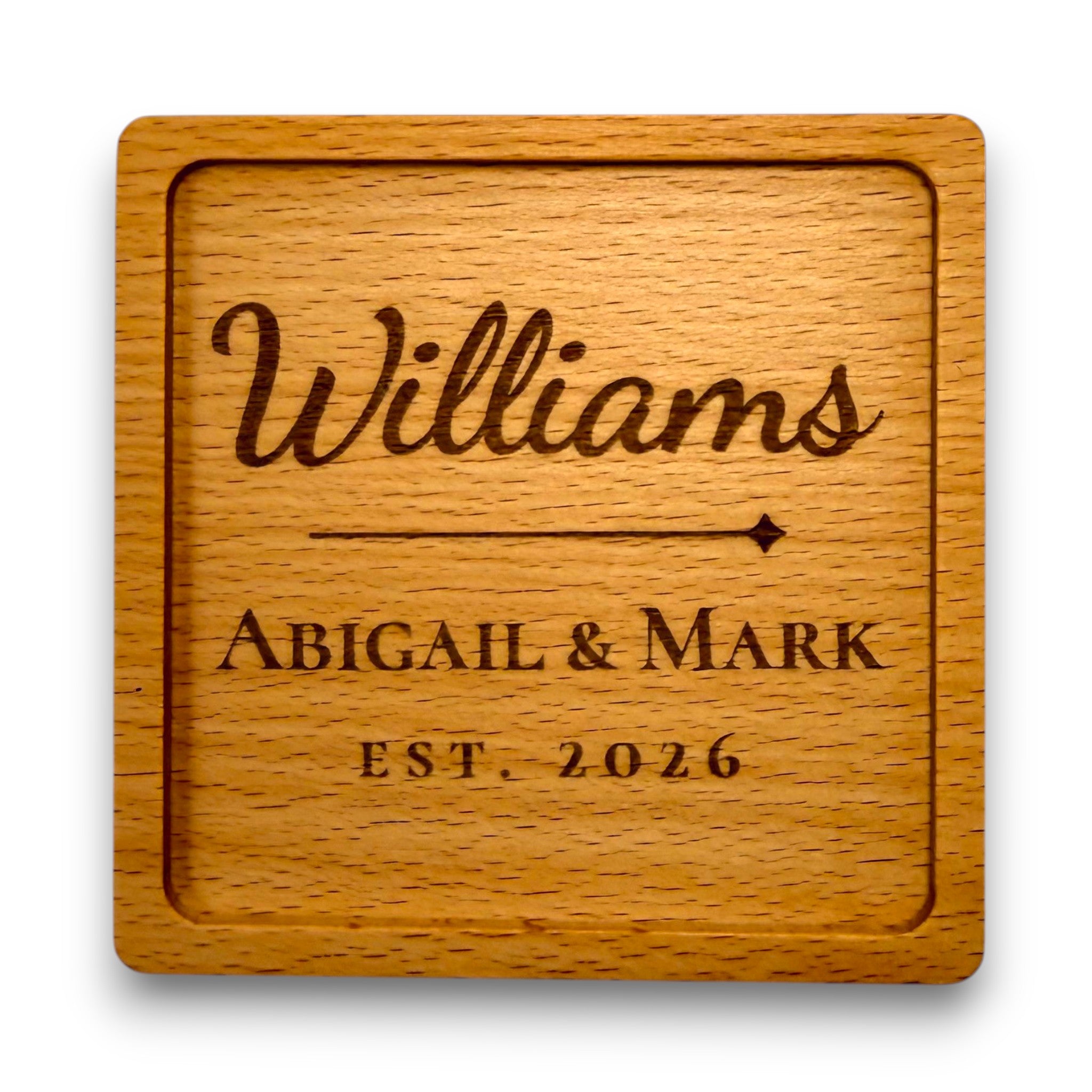 Wooden coaster made of beech featuring a personalized laser engraved design.