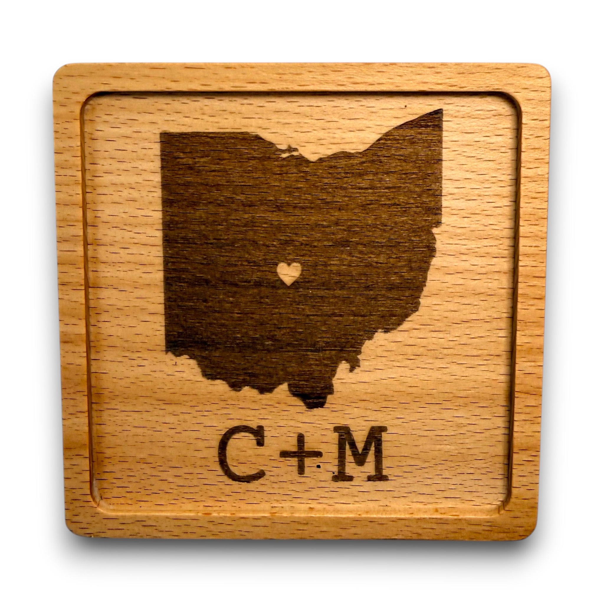 Wooden coaster made of beech featuring a personalized laser engraved design.