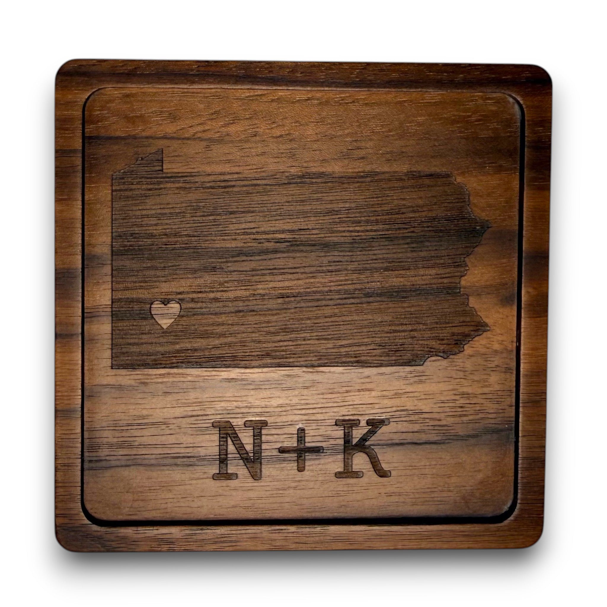 Wooden coaster made of black walnut featuring a personalized laser engraved design.