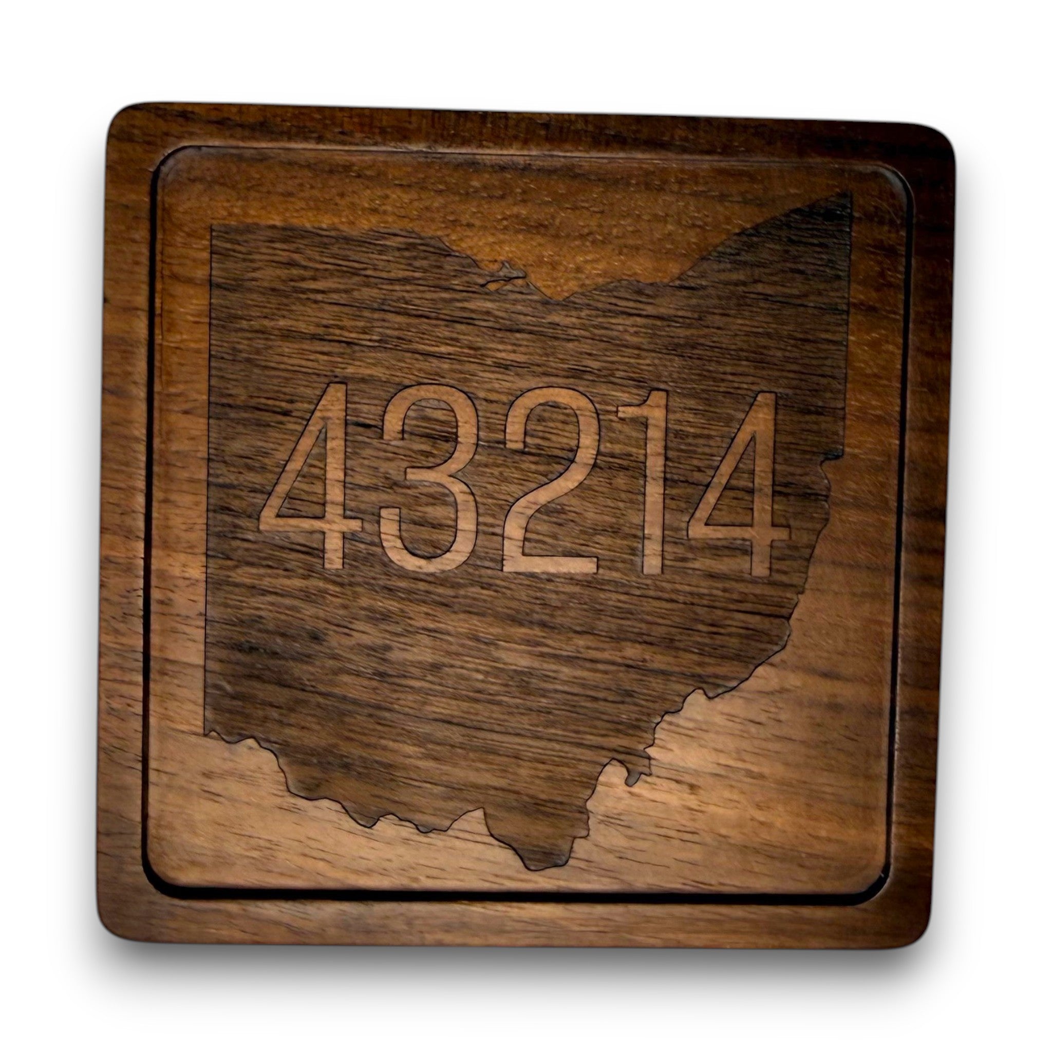Wooden coaster made of black walnut featuring a personalized laser engraved design.